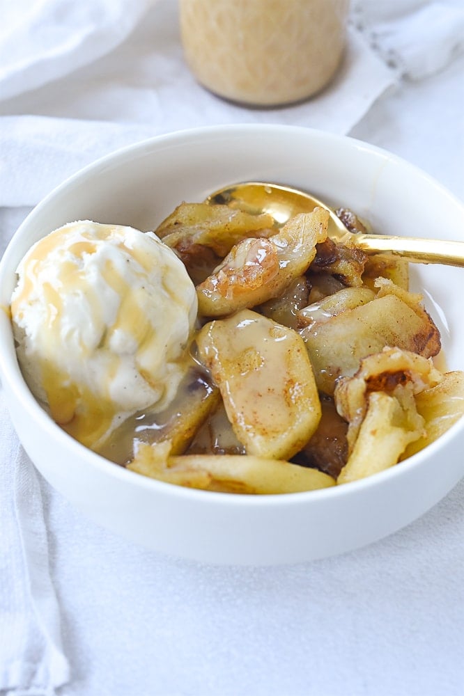 bowl of caramlized apples and ice cream