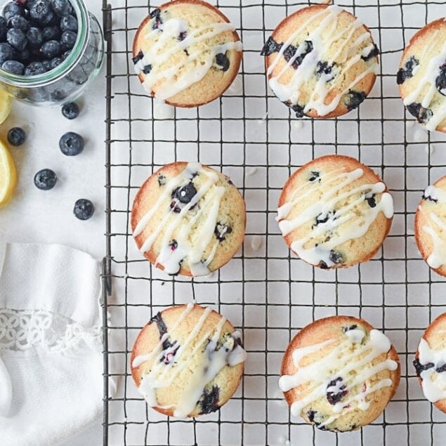 blueberry lemon muffins on a cooling rack