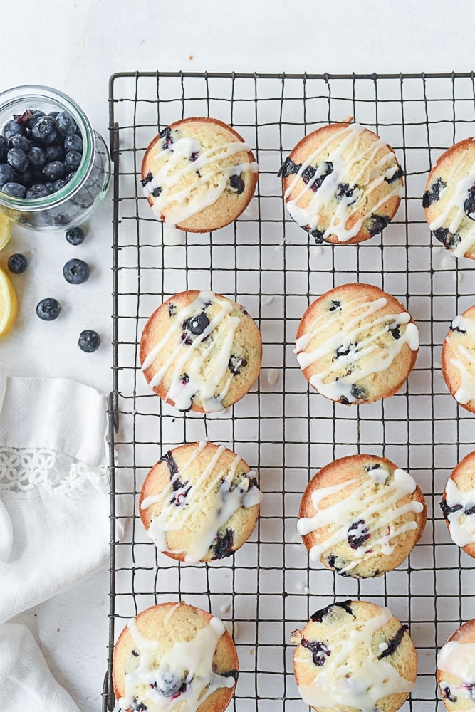 blueberry lemon muffins on a cooling rack