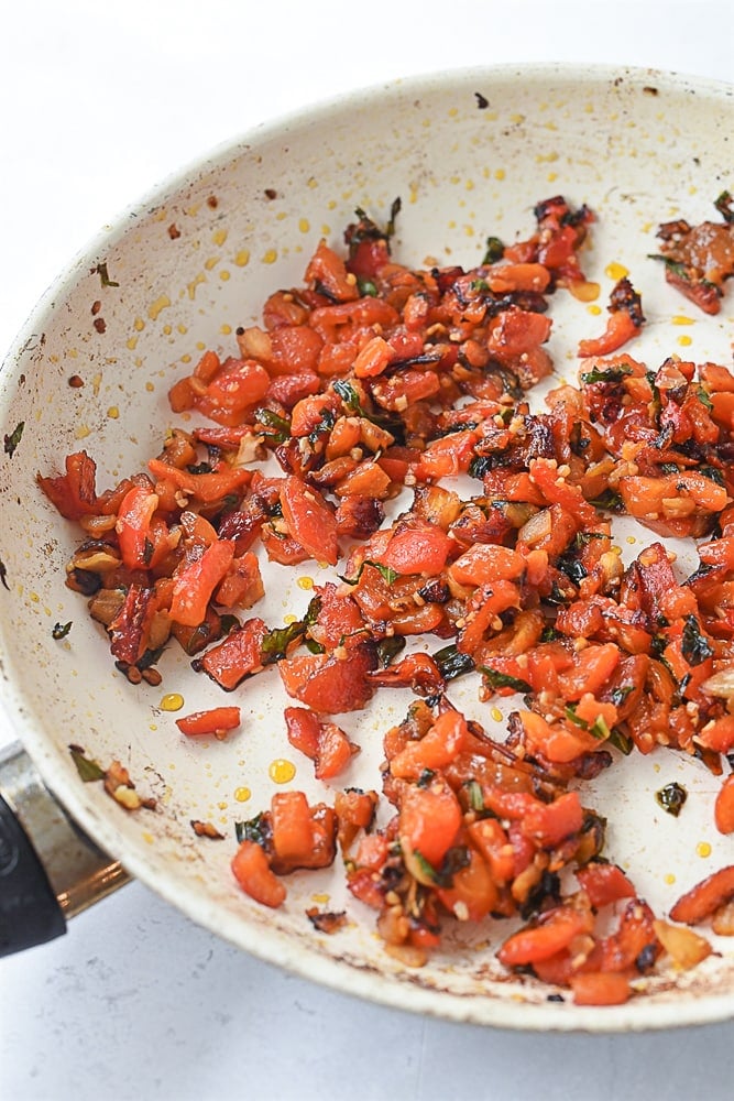 diced roasted red pepper in pan