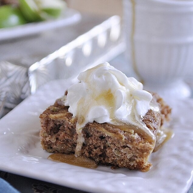 apple cake with caramel sauce and whipped cream