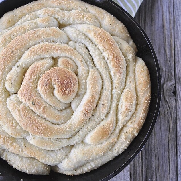 garlic parmesan bread in cast iron pan