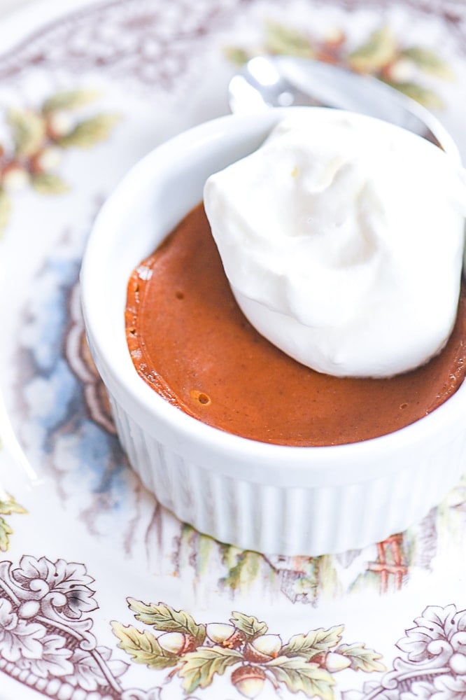 pumpkin pie topped with whip cream