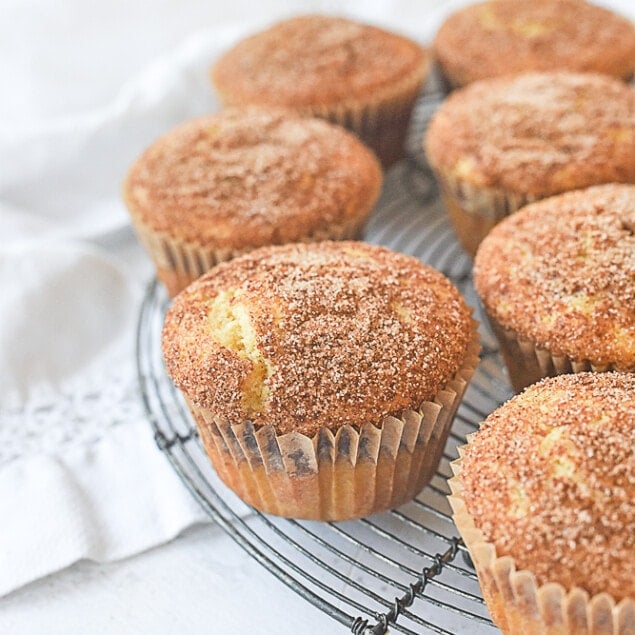 snickerdoodle muffins on a cooling rack