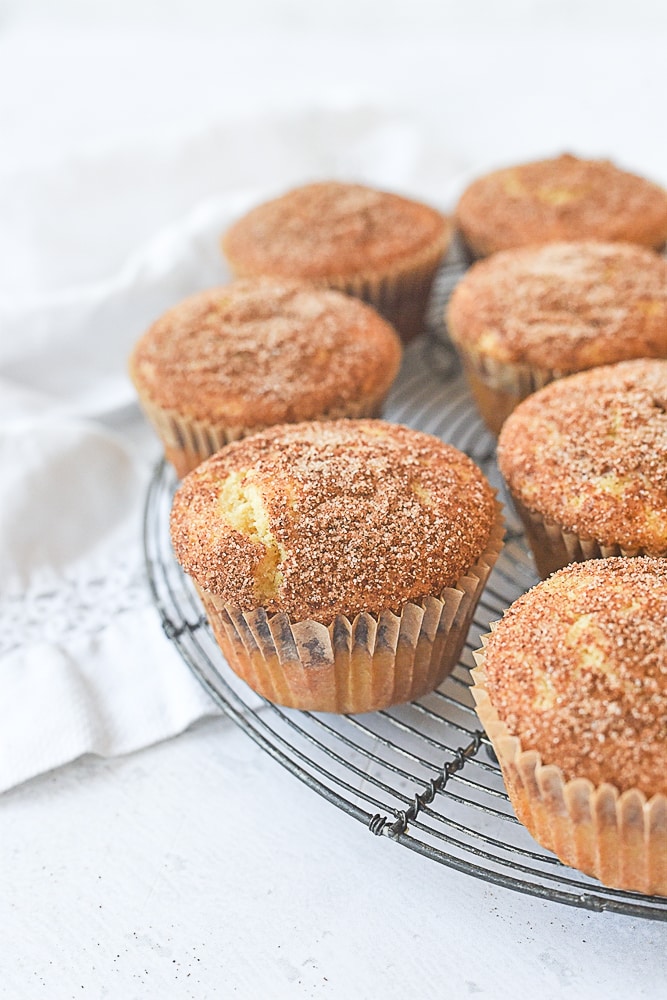 snickerdoodle muffins on a cooling rack