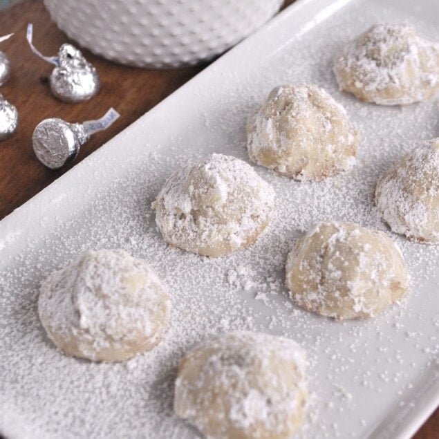 snowball cookies on a white plate