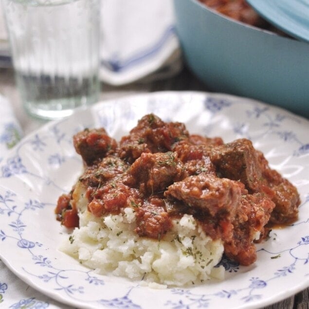 swiss steak over potatoes