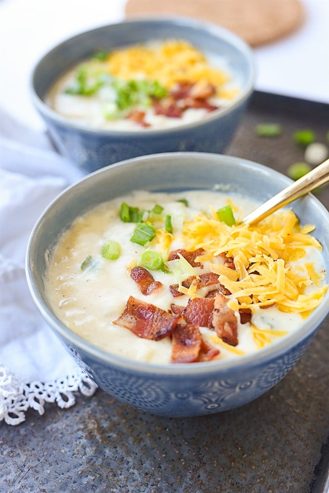 two bowls of baked potato soup