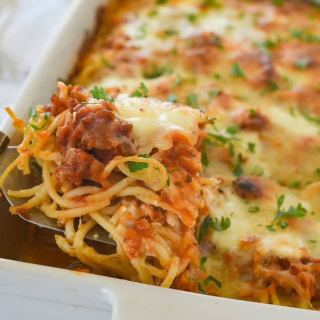 closeup of a fork full of baked spaghetti