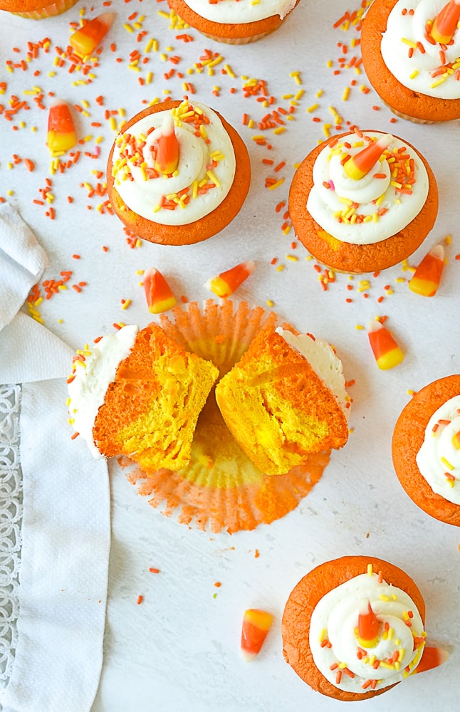 sliced open candy corn cupcake