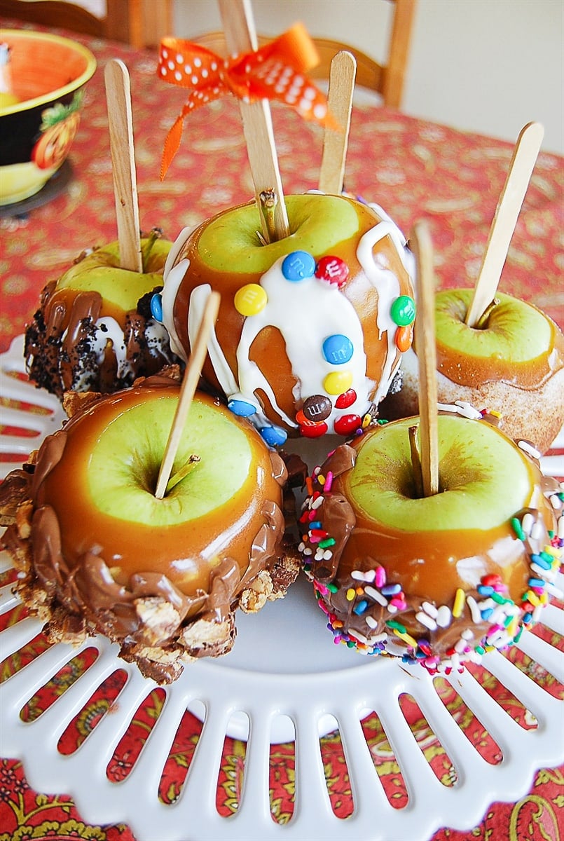 caramel apples on a cake stand