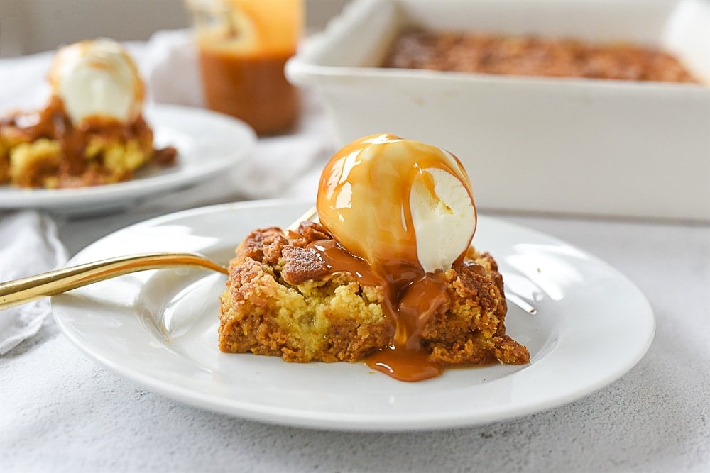 pumpkin dump cake with ice cream and caramel sauce