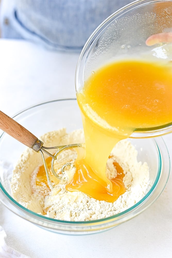 pouring batter into white chocolate brownies