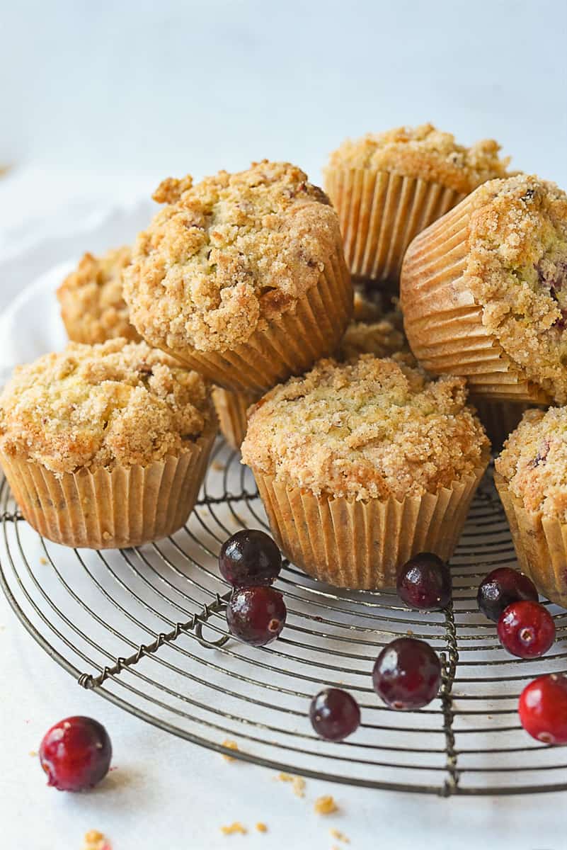 pile of egg nog muffins on a cooling rack