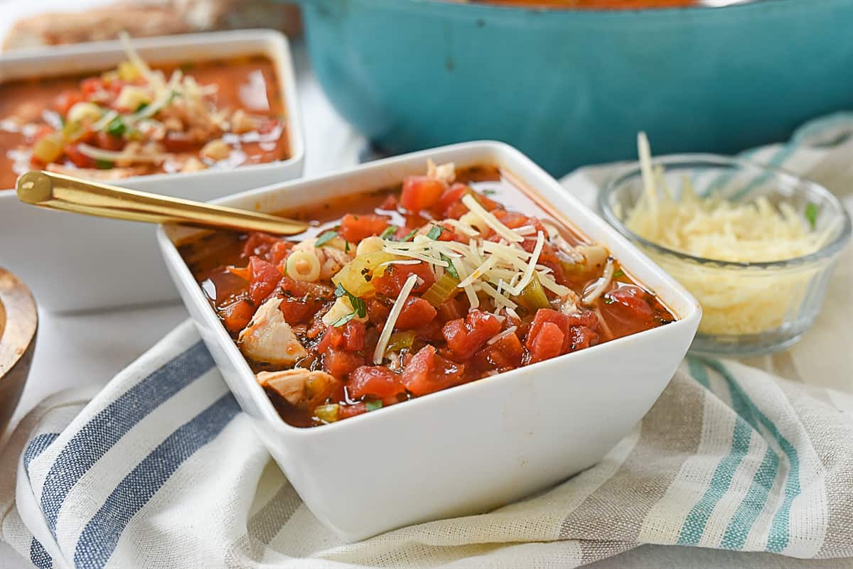 white bowl of turkey soup