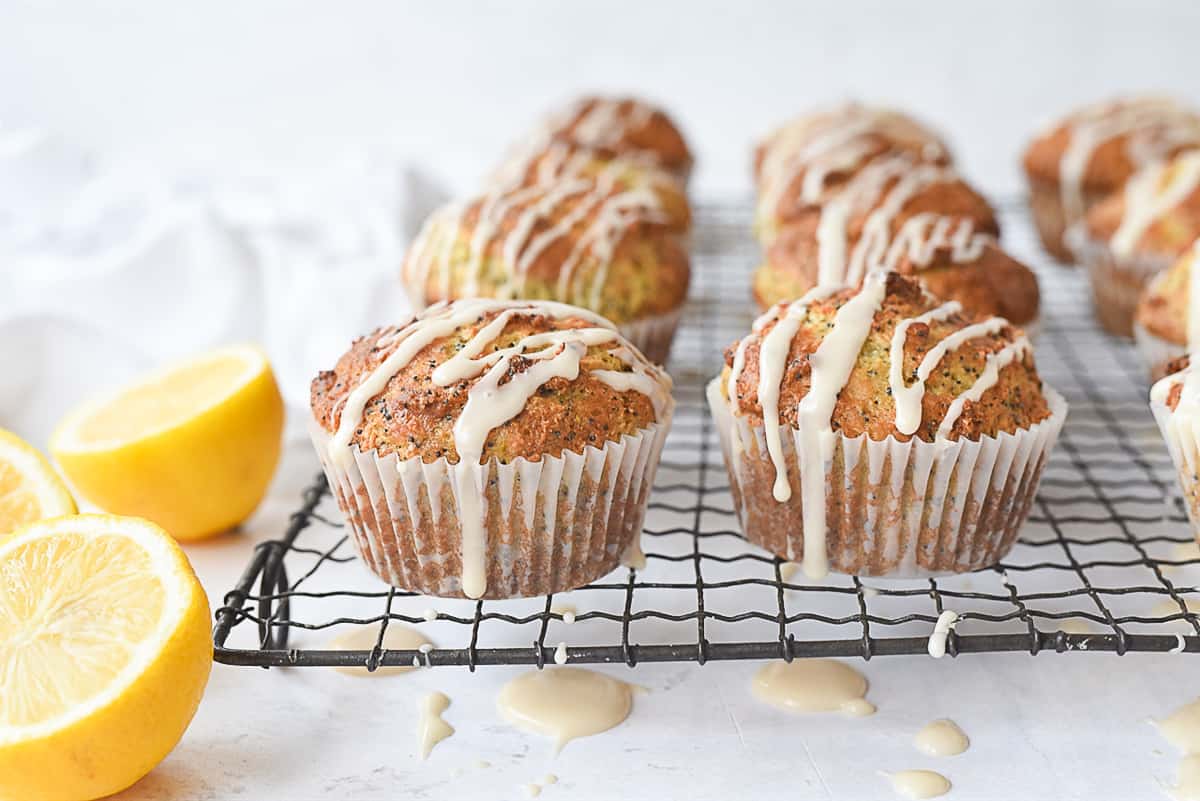 drizzled muffins on a cooling rack