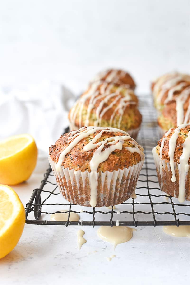 lemon poppy seed muffins on a cooling rack