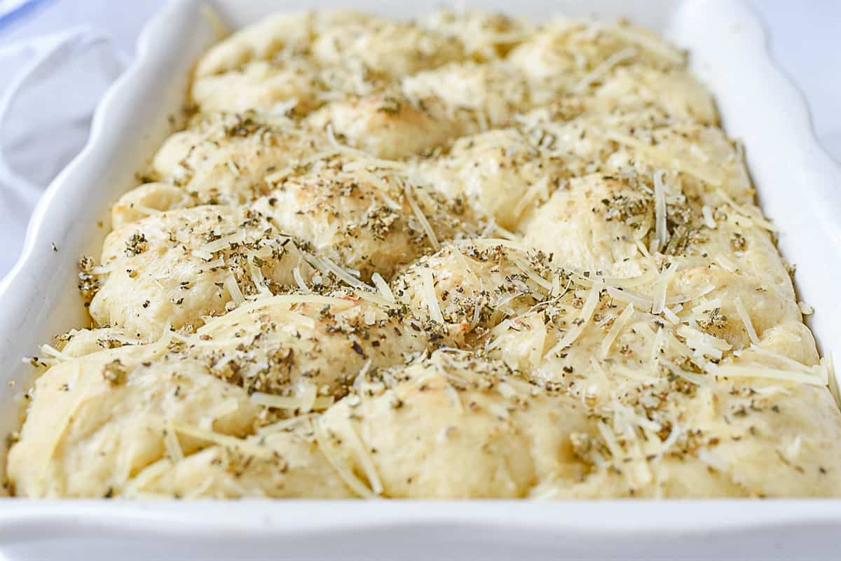 cheese and herb mixture on dough