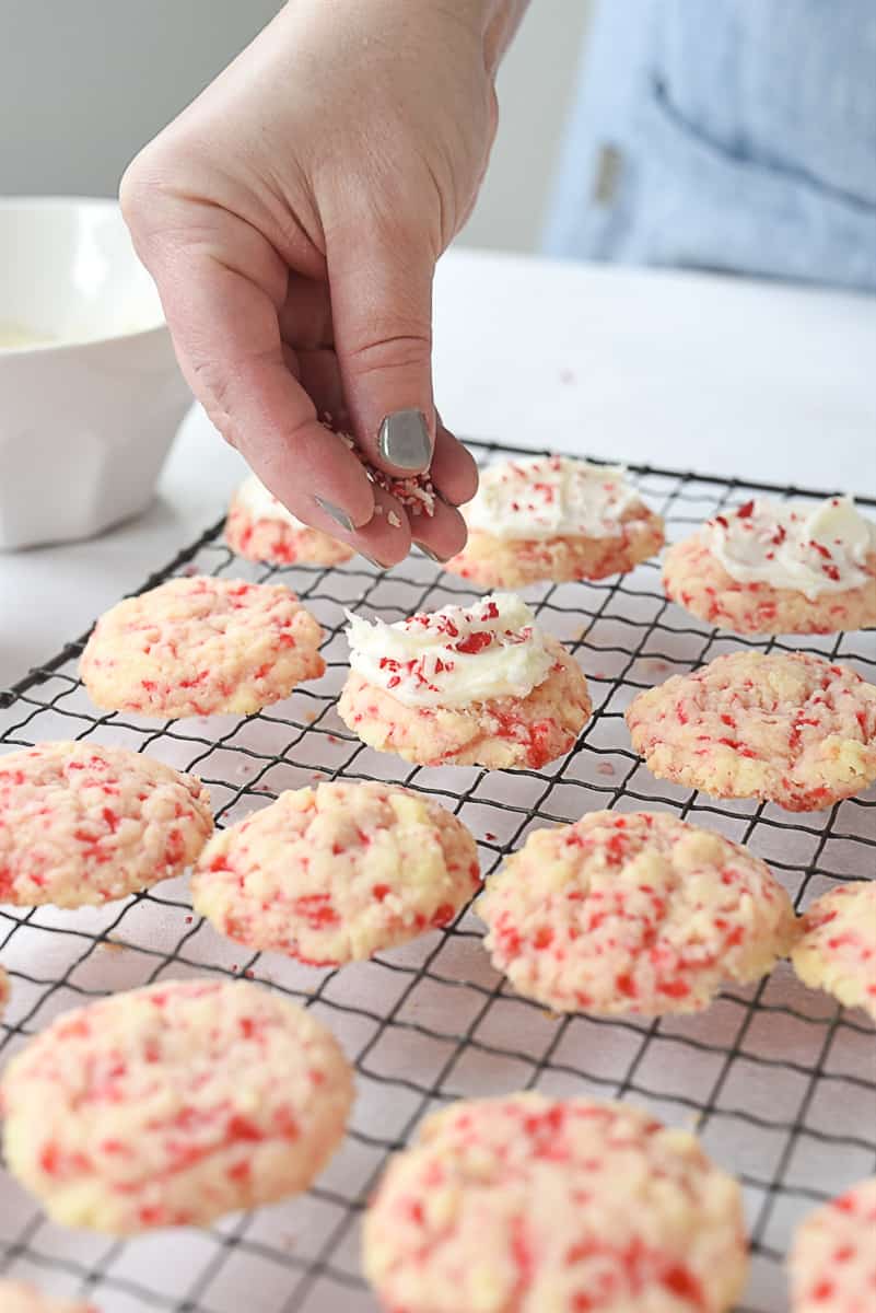 sprinkling peppermint on cookies