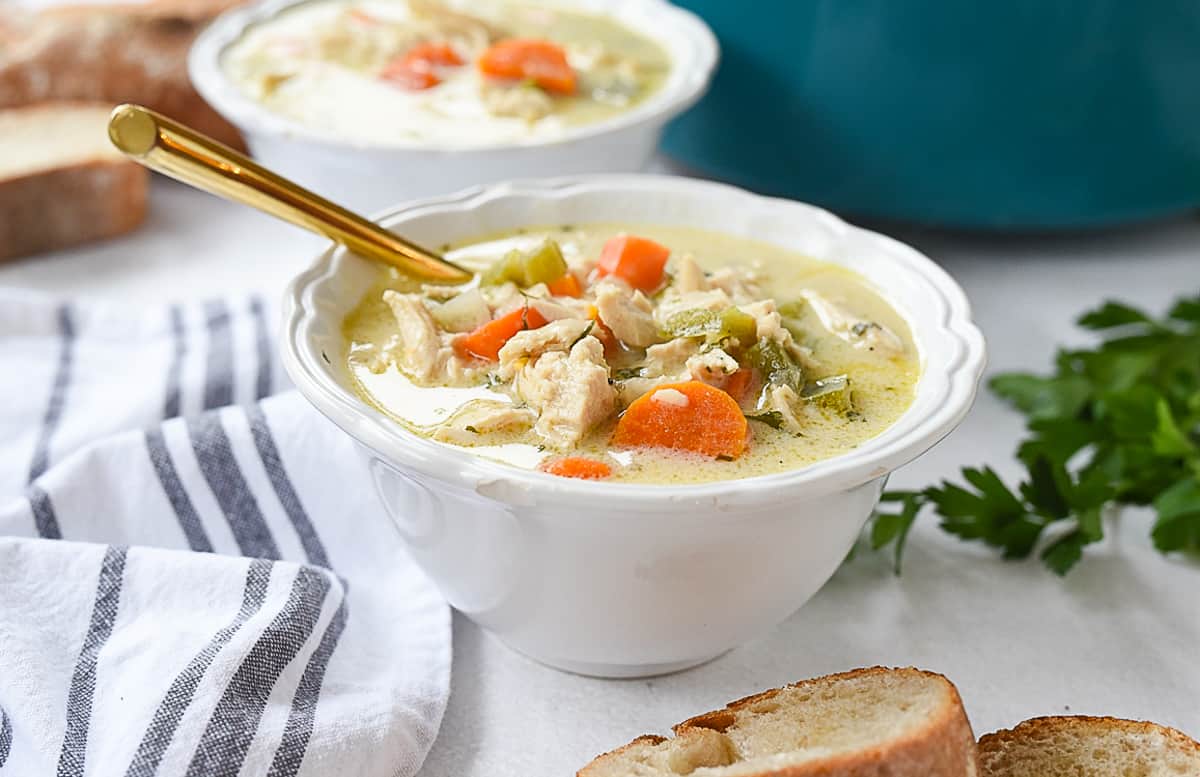 white bowl of turkey soup