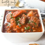 white bowl of beef soup