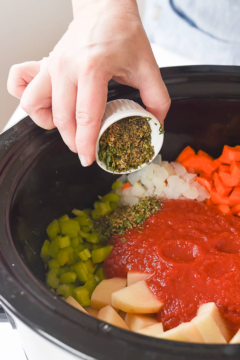 adding seasoning to crock pot