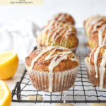 glazed lemon poppy seed muffins on a rack