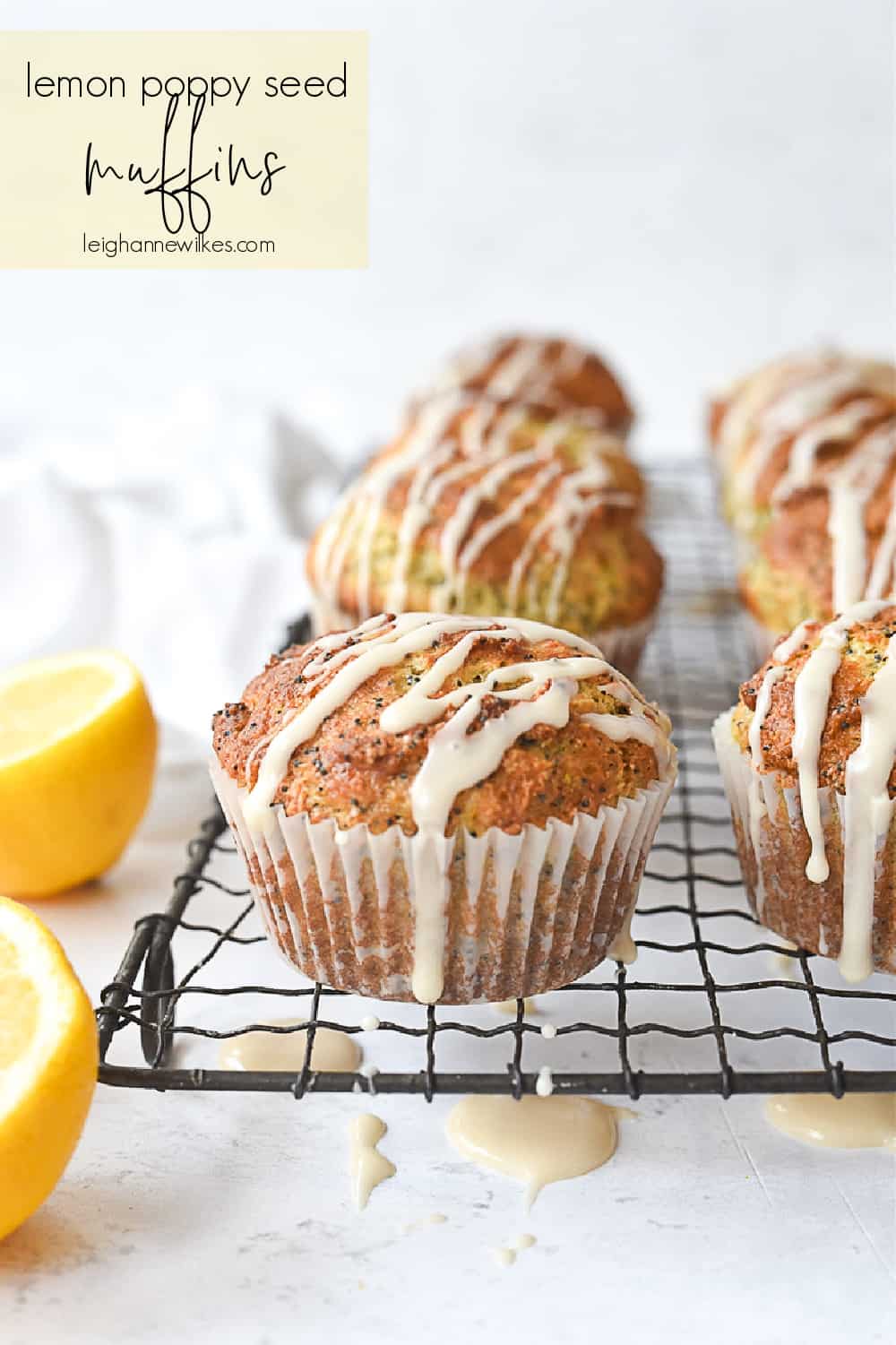 glazed lemon poppy seed muffins on a rack