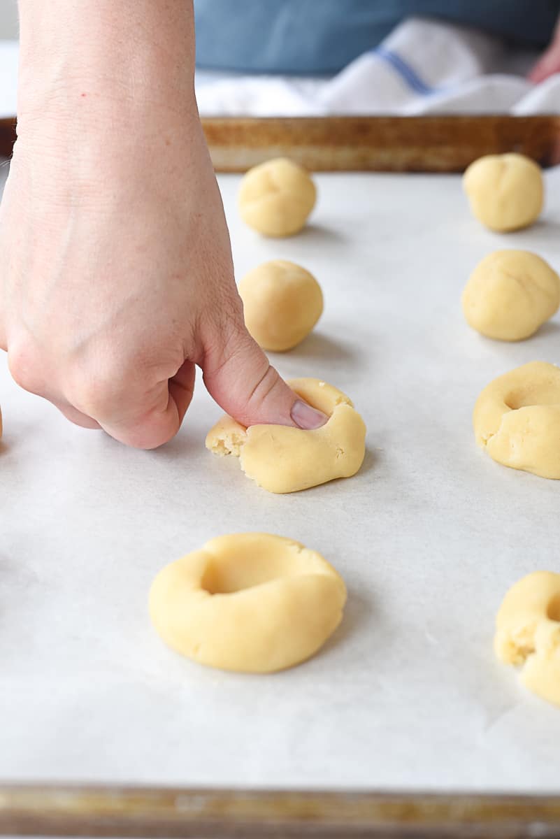 pushing thumb into shortbread dough