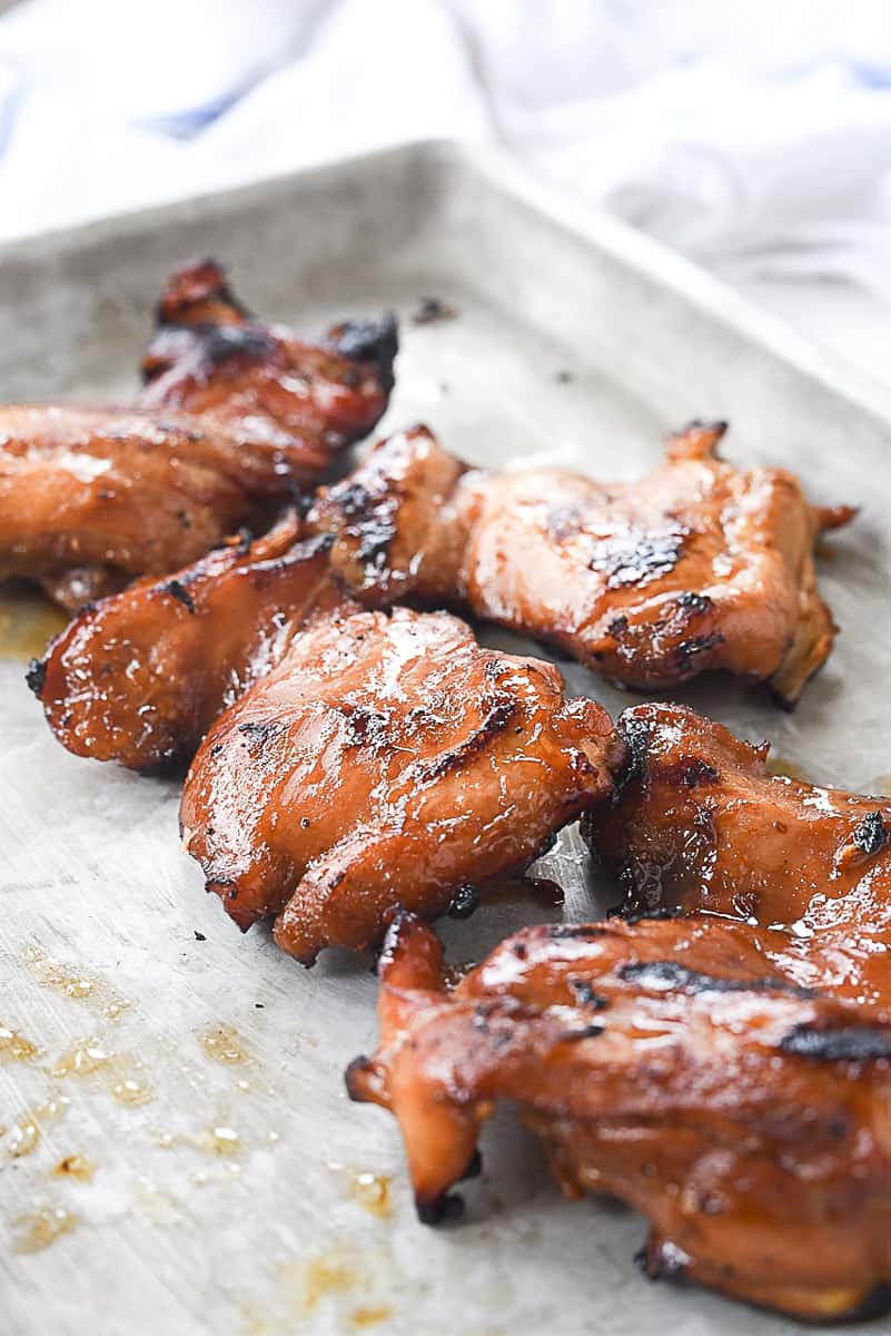 grilled chicken on a baking sheet