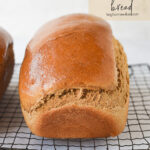 loaf of whole wheat bread on a cooling rack