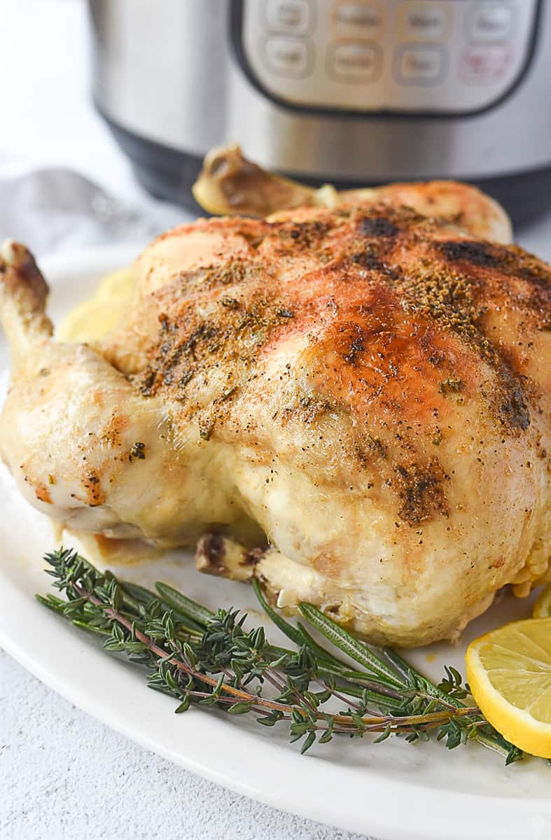 whole chicken in front of an instant pot