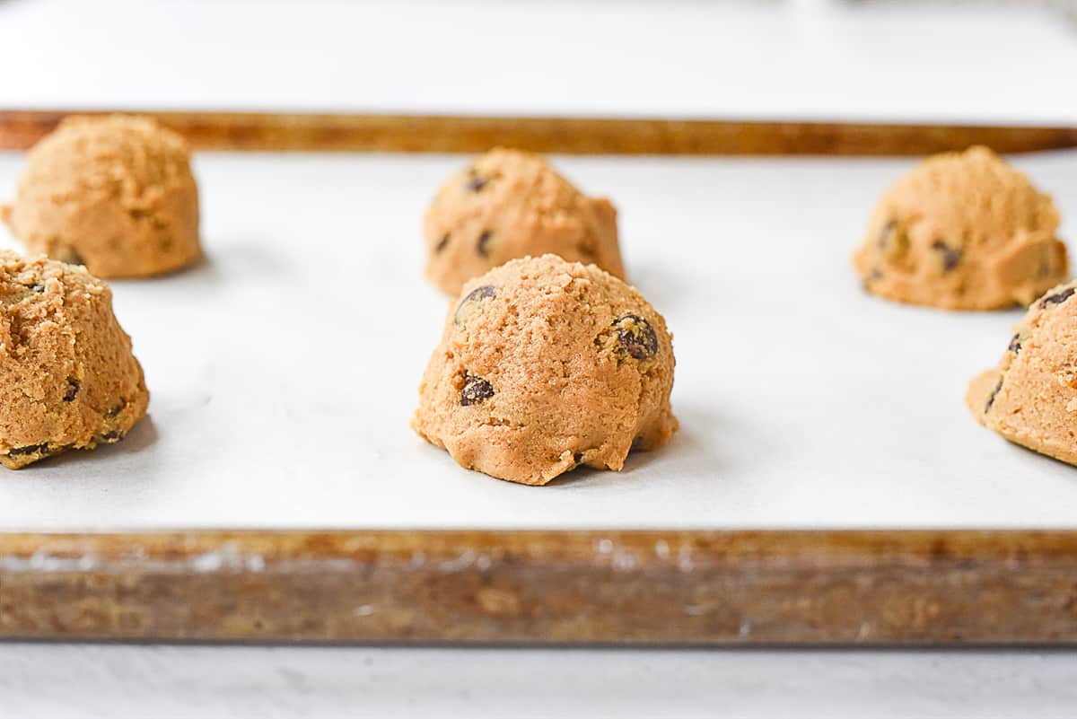 balls of cookie dough on baking sheet