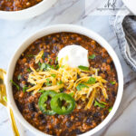 bowl of black bean chili with cheese on top