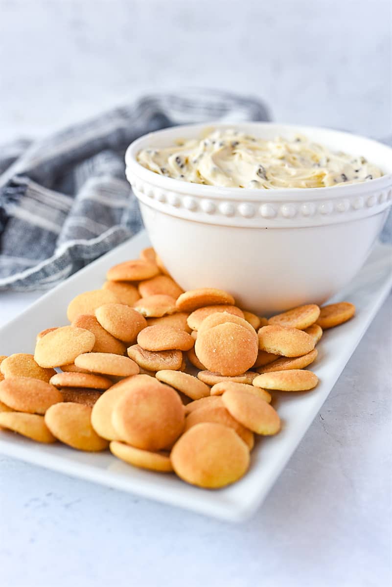 bowl of cookie dough dip and cookies on a plate