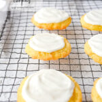 frosted sugar cookies on baking rack