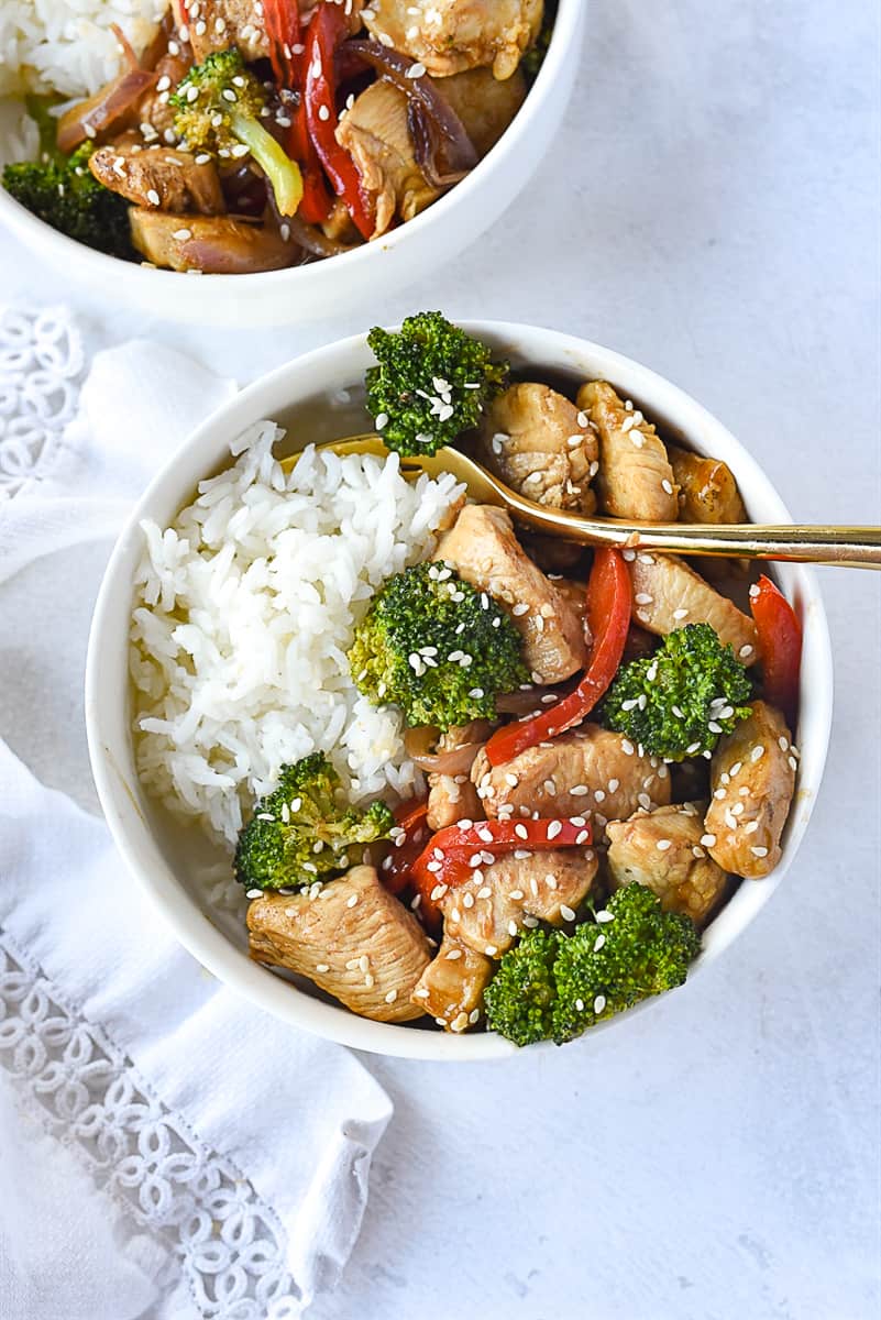 Red Pepper and CHicken Stir Fry in a bowl over rice