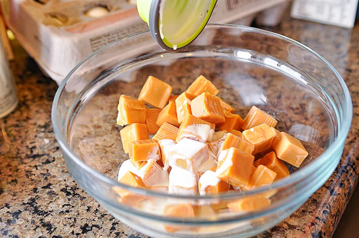 adding milk to caramel