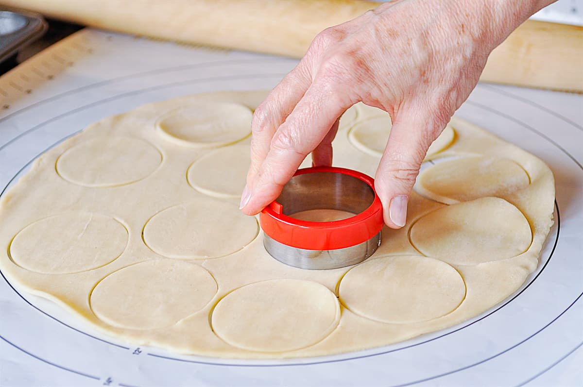 cutting out circles of dough