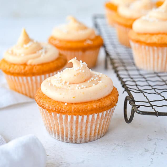 orange cupcakes with orange frosting on top