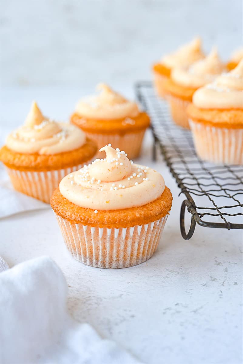 orange cupcakes with orange frosting on top