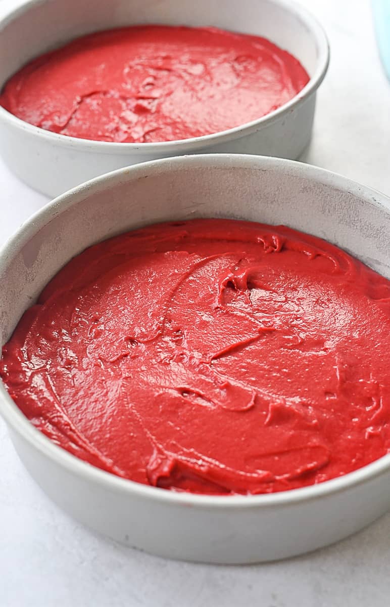 red velvet cake batter in two pans