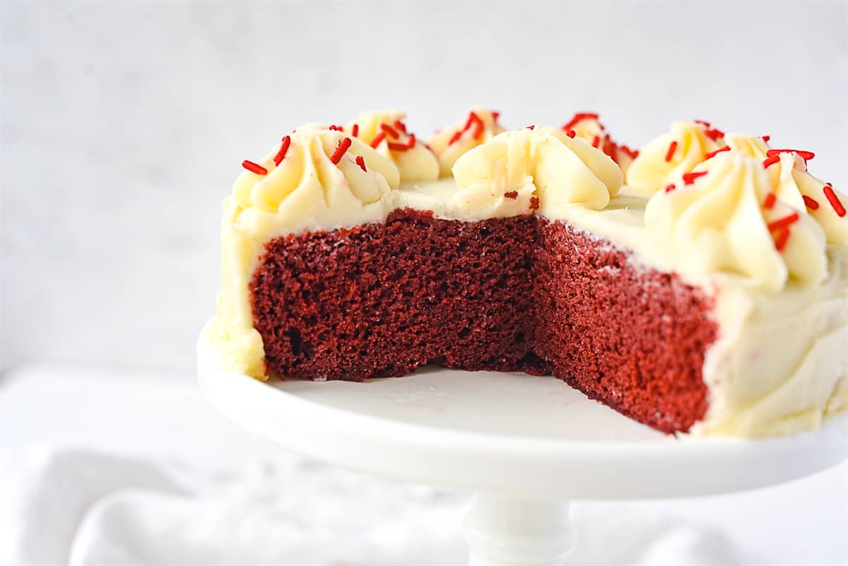 red velvet cake with piece missing