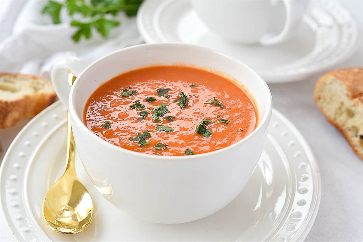 roasted red pepper soup in a white bowl
