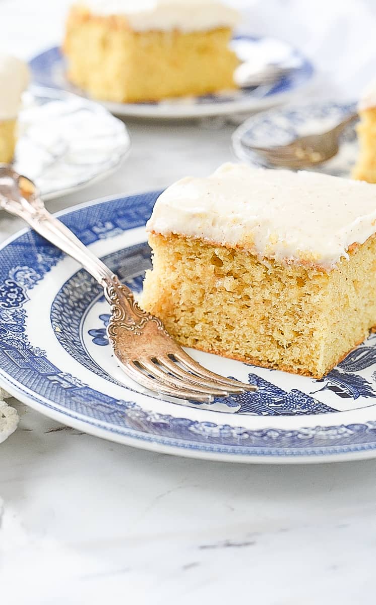 slice of brown butter cake on a plate wth a fork