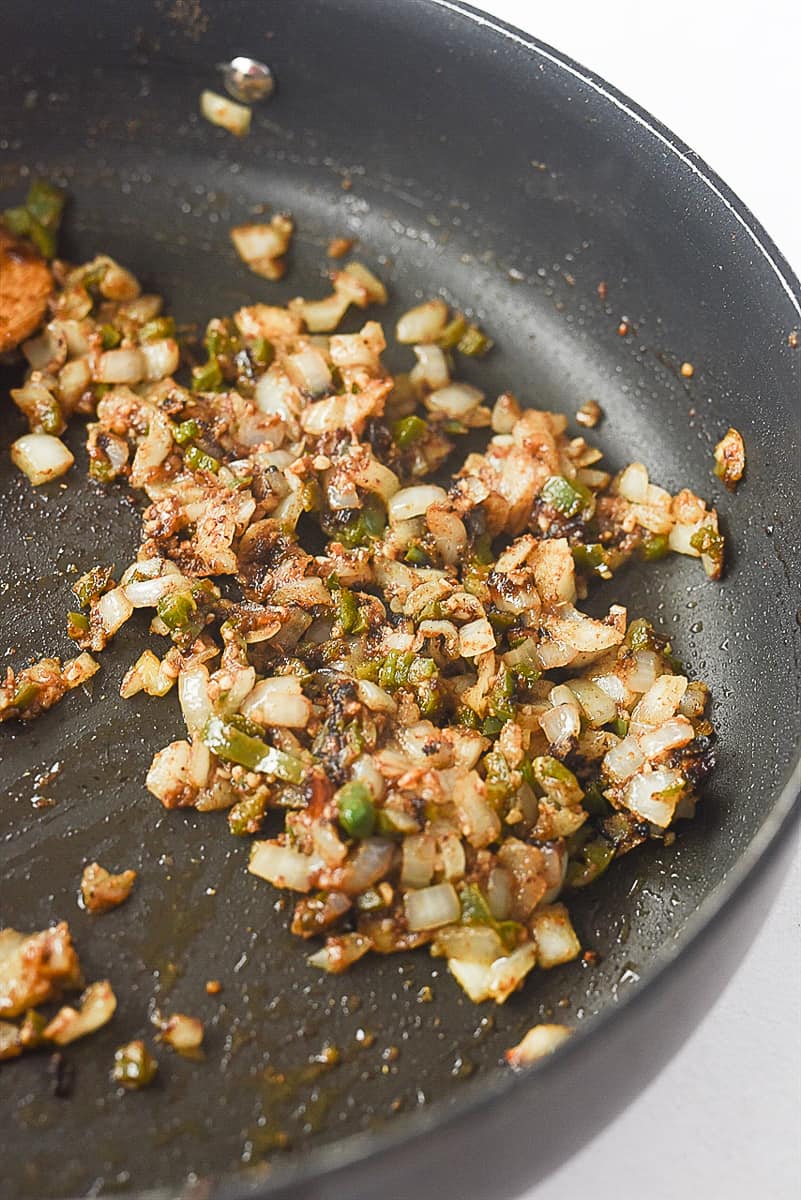 pan of sauteed onions and jalapeno pepper