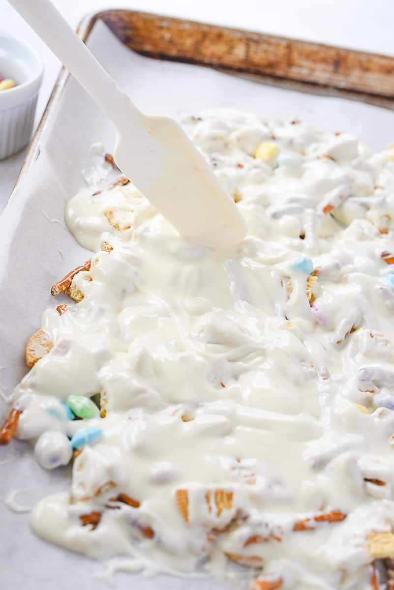 spatula spread chocolate on easter bark