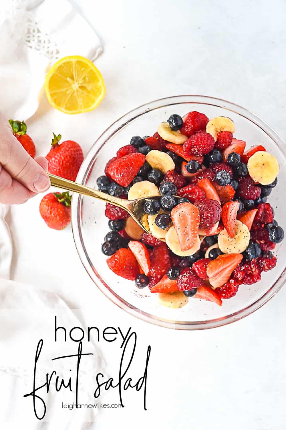 bowl of fruit salad with a spoon in it