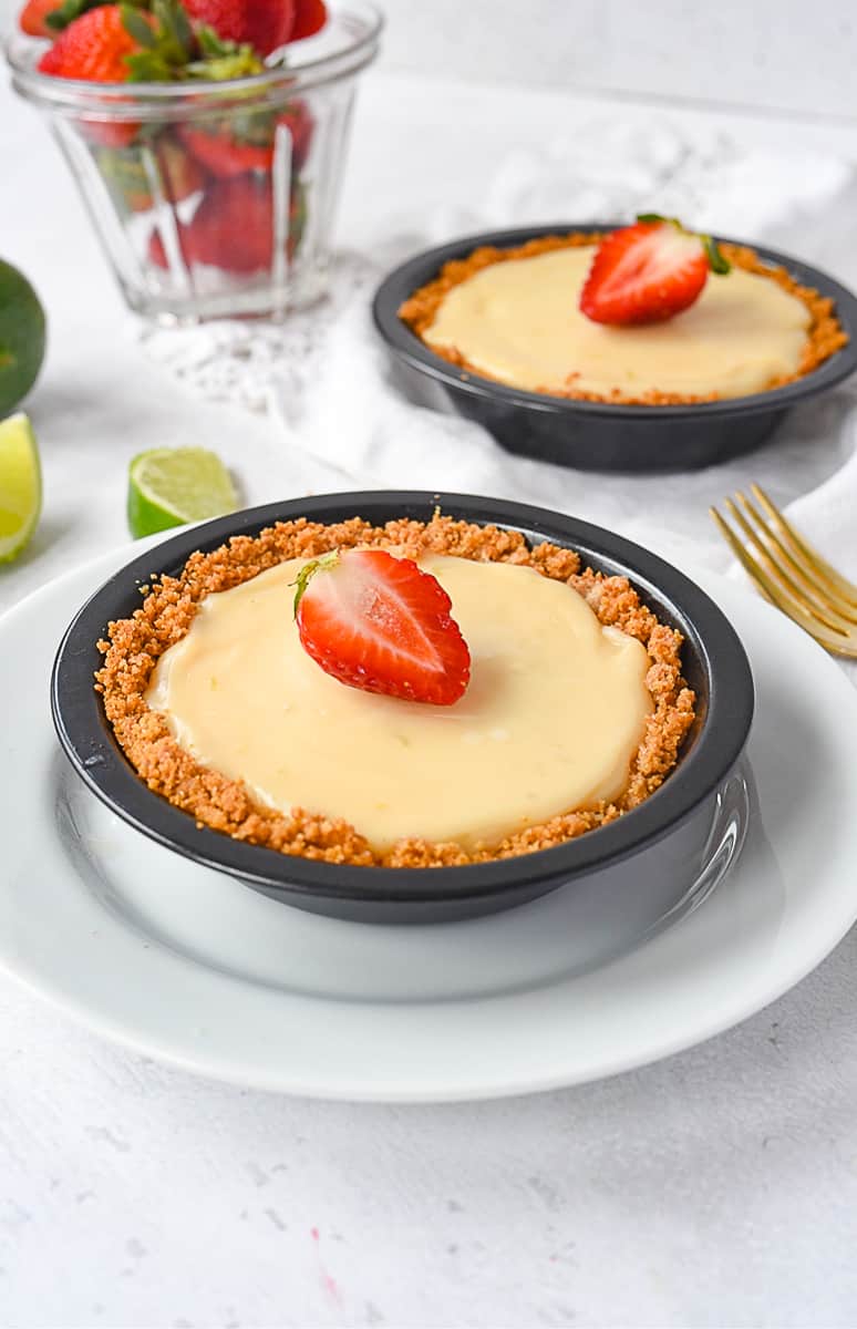 individual key lime pies with strawberries on top