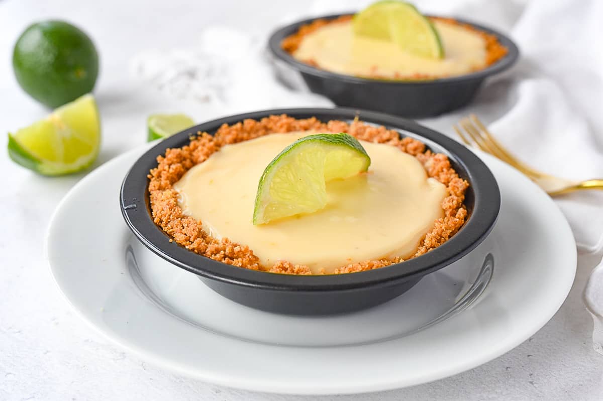 two key lime pies on a plate